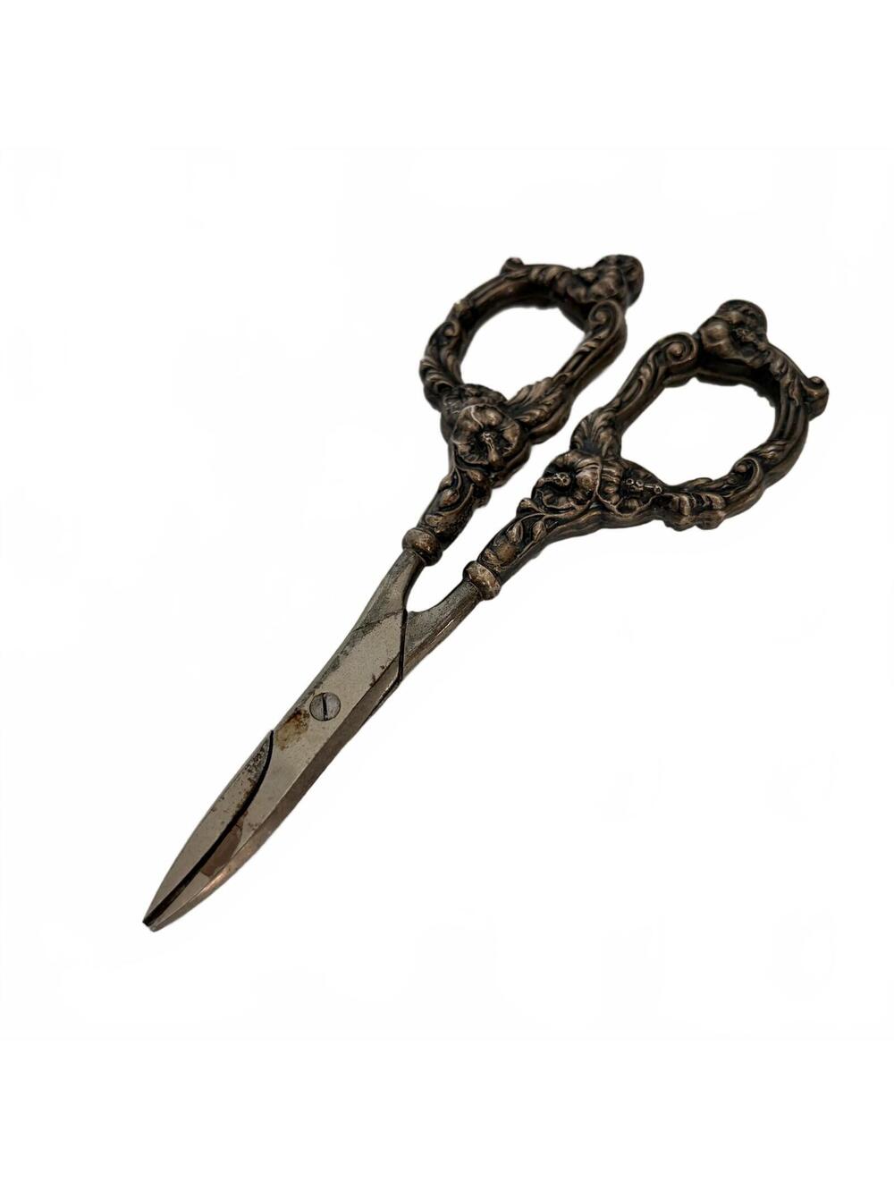 Antique Ornate sterling silver grape shears with floral and figural decoration.